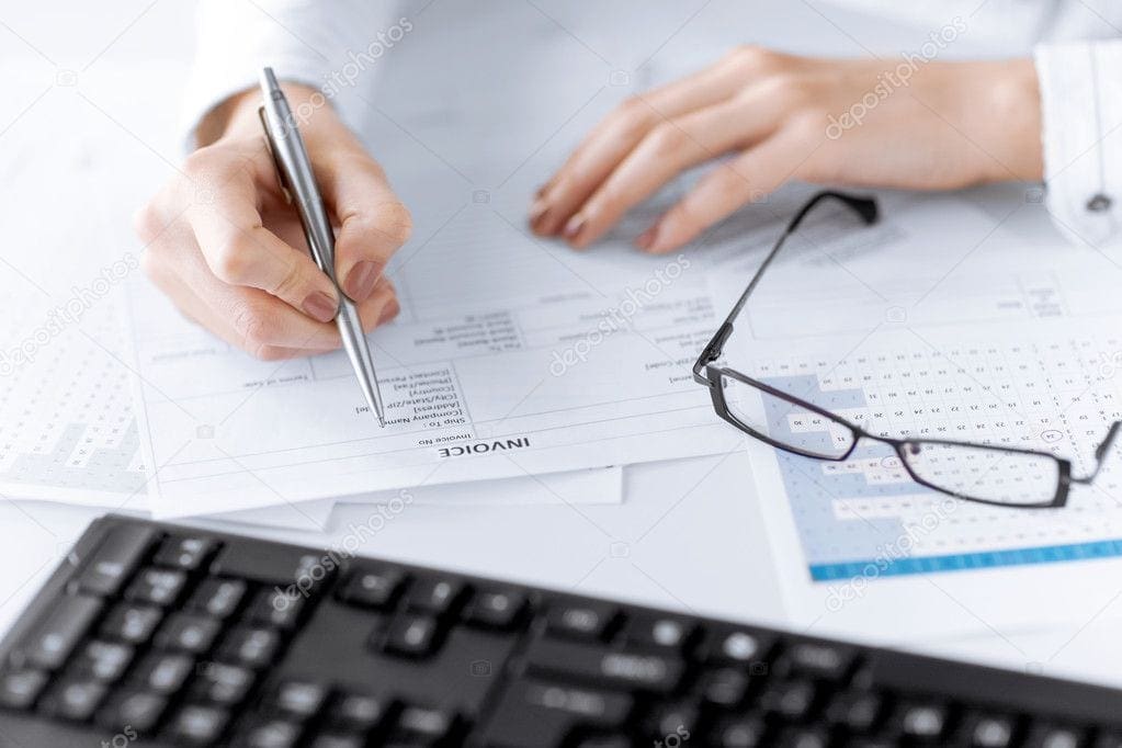 depositphotos_28072207-stock-photo-woman-hand-filling-in-invoice