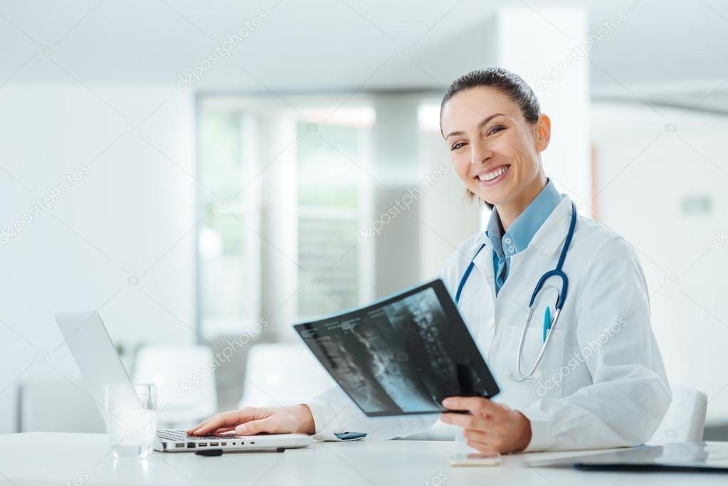 depositphotos_80150830-stock-photo-smiling-female-doctor-examining-an